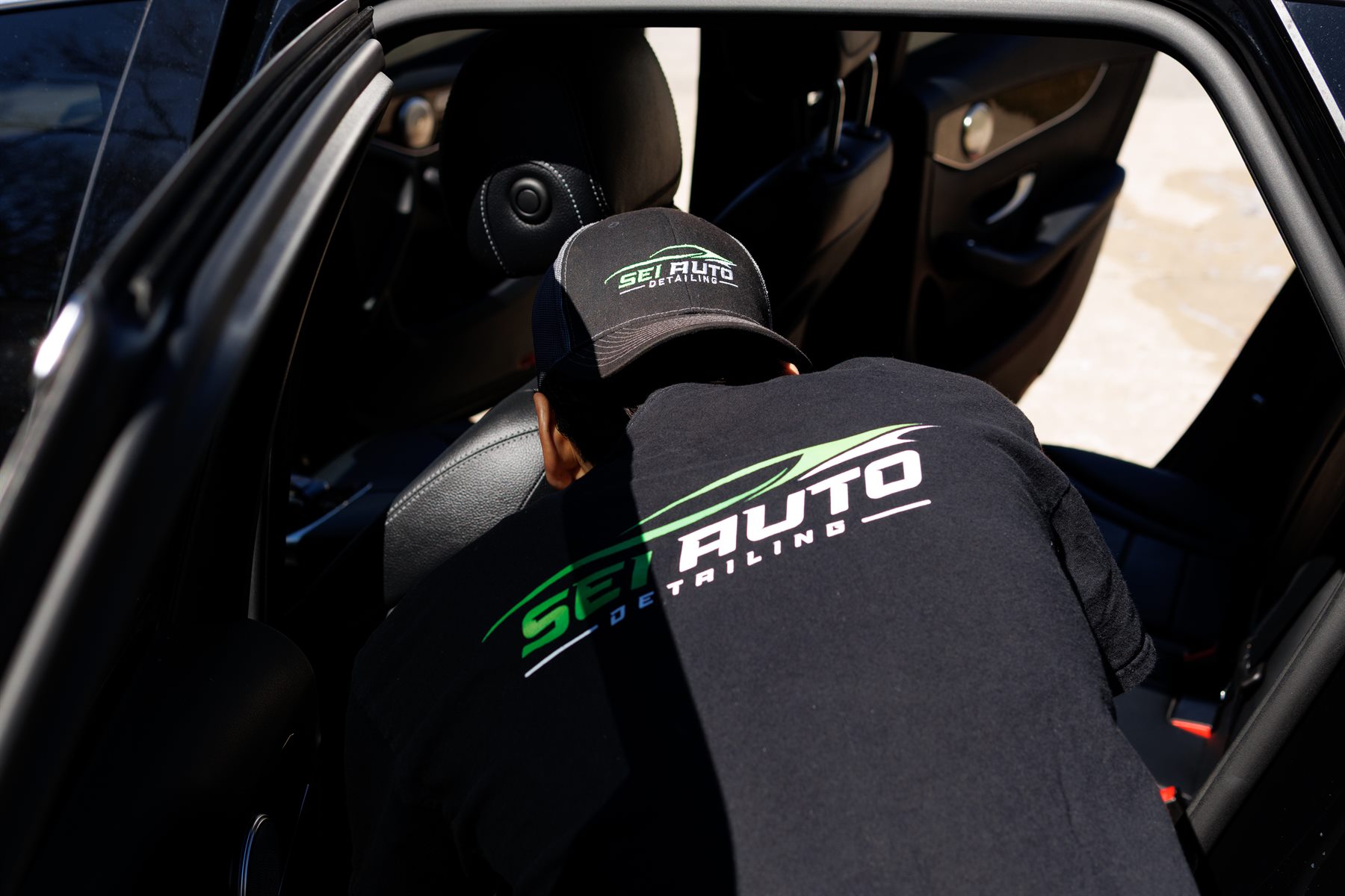 SEI Auto Detailing interior service with branded apparel